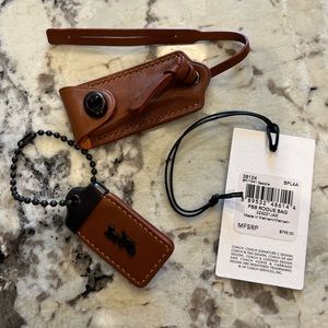 Coach 1941 Rogue Clochette Charm Key Holder saddle color.